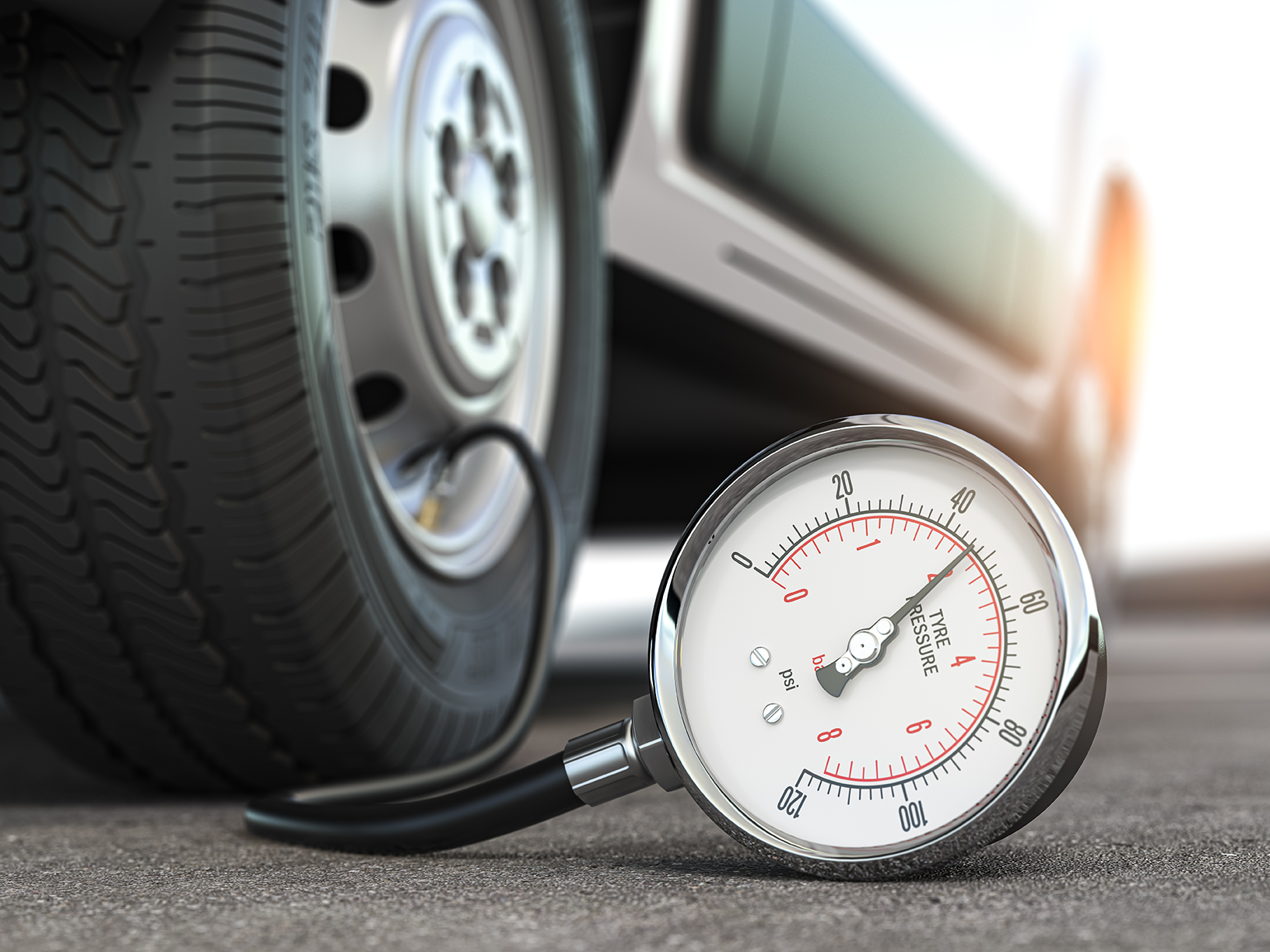 tire pressure gauge attached to a car tire